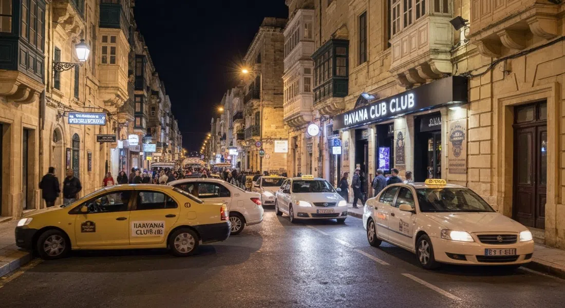 la entrada de Havana Club en St George's Road, luces de club derramándose sobre la acera mientras los taxis dejan caer multitudes nocturnas